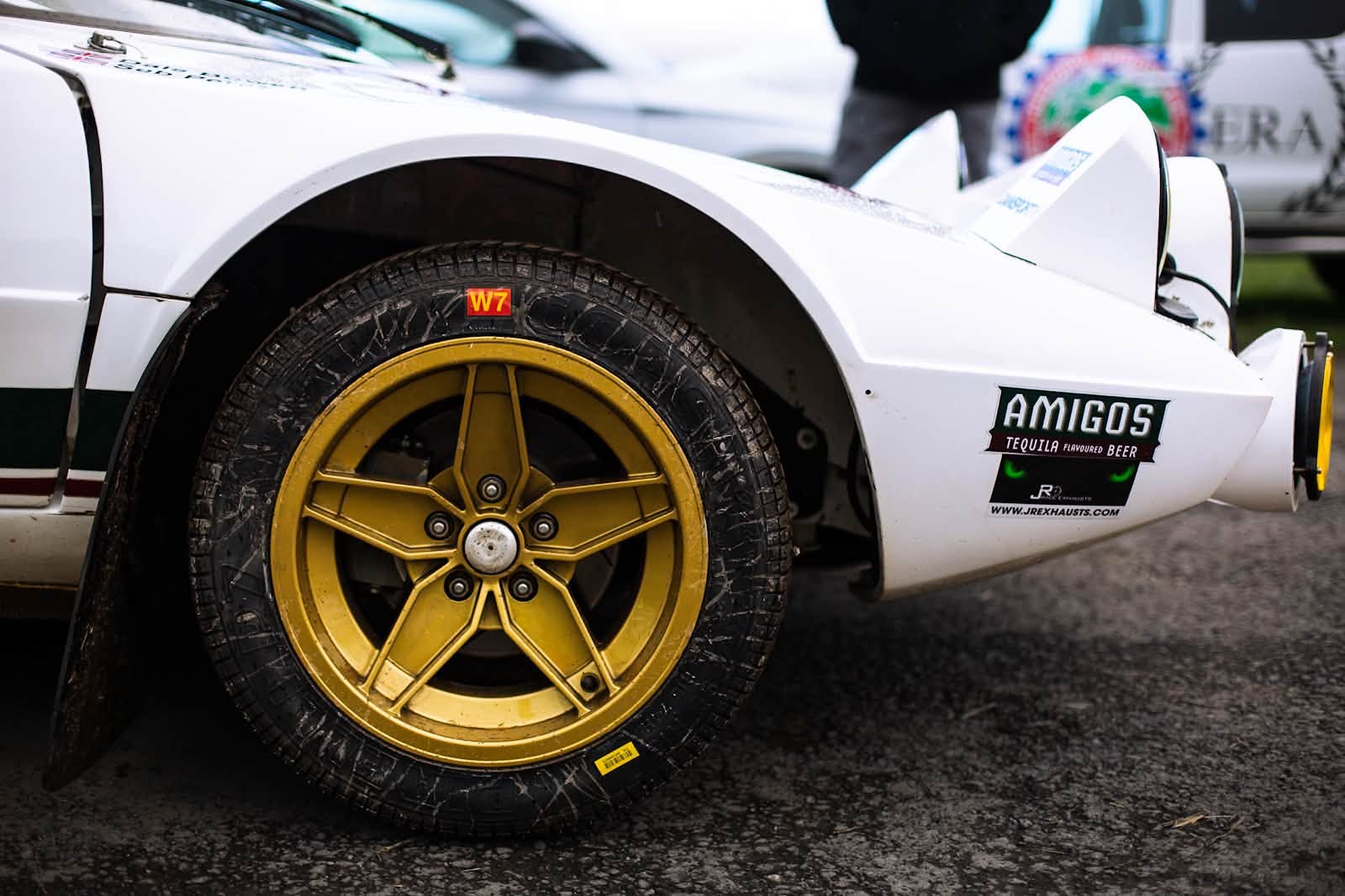 Gold wheel and Amigos Tequila livery detail on the Perez Lancia Stratos in the service park